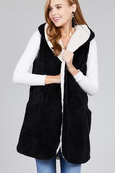 Stay nice and warm this winter in this super plush fluffy vest. It will feel like you are being hugged by a warm cloud. These run true to size. Fabric Content 100% POLYESTER Hooded Plush Outerwear For Winter, Sleeveless Sweater Vest For Winter, Sleeveless Vest With Fleece Lining For Winter, Winter Sleeveless Vest With Fleece Lining, Winter Sweater Vest For Cold Weather, Winter Sleeveless Sweater Vest For Cold Weather, Sleeveless Black Outerwear With Fleece Lining, Cozy Winter Vest For Cold Weather, Fluffy Vest