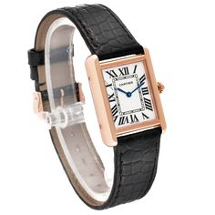 Cartier Tank Solo Silver Dial Rose Gold Steel Ladies Watch W5200024. Quartz movement. 18k rose gold 30.0 x 24.4 mm case with stainless steel caseback. Circular grained crown set with blue spinel cabochon. . Scratch resistant sapphire crystal. Opaline silver dial with black Roman numerals. Sword shaped blued steel hands. Secret Cartier signature at X. Black leather strap with an 18k rose gold tang buckle. Timeless Cartier Rectangular Watch, Cartier Timeless Rectangular Watch Accessories, Timeless Rectangular Cartier Watch Accessories, Timeless Rectangular Cartier Watch, Elegant Rectangular Watch Band For Formal Occasions, Elegant Rectangular Watch Bands For Formal Occasions, Classic Cartier Rectangular Watches, Cartier Rectangular Business Watch, Cartier Rectangular Business Watch Accessories