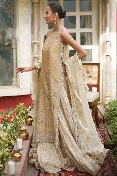 Festive Embellished Beige Sharara, Festive Beige Embellished Sharara, Embellished Straight Kurta Dress, Embellished Beige Sharara For Reception, Festive Embellished Beige Sets, Cream Embellished Anarkali Set, Embellished Beige Anarkali Sets, Elegant Floor-length Chanderi Palazzo Set, Beige Embellished Anarkali Sets