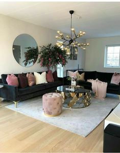 a living room filled with furniture and a chandelier