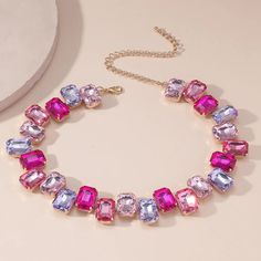 Add a touch of girly bling with our Large Pink Crystal Jewels Choker. This playful accessory features oversized pink crystals that will catch the eye and add a bit of sparkle to any outfit. Perfect for those who love to stand out and have a little fun with their fashion choices! Pink Rhinestone Jeweled Necklace For Parties, Pink Jeweled Rhinestone Necklace For Party, Glamorous Pink Rhinestone Necklace For Party, Pink Crystal Embellished Jewelry For Party, Pink Crystal-embellished Jewelry For Party, Pink Rhinestone Party Necklace, Pink Rhinestone Necklace With Bling For Gift, Pink Rhinestone Bling Necklace For Gift, Pink Rhinestone Bling Necklace Gift