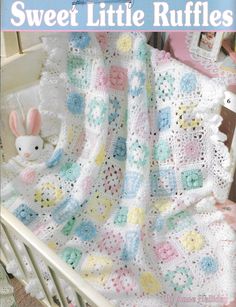 a crocheted baby blanket with bunny on it and the words sweet little ruffles written in white