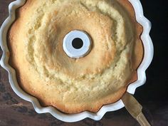 a cake in a pan with a knife on the side