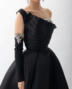 Experience elegance and glamour in our Dreamy Vow one shoulder evening dress. Made with luxurious black satin and embellished with sparkling crystals, this dress exudes sophistication and style. Perfect for any special occasion, it will make you stand out and feel confident. window.adminAccountId=244214477; Black One Shoulder Dress For Prom, Black One Shoulder Dress For Prom Season, Embellished Off-shoulder Evening Dress, Elegant Black One-shoulder Dress For Gala, Black Dress With Asymmetrical Neckline For Wedding, Glamorous Black One Shoulder Dress For Prom, Glamorous Embellished One Shoulder Evening Dress, Black Evening Dress With Asymmetrical Neckline For Wedding, Black Evening Dress With Asymmetrical Neckline For Gala