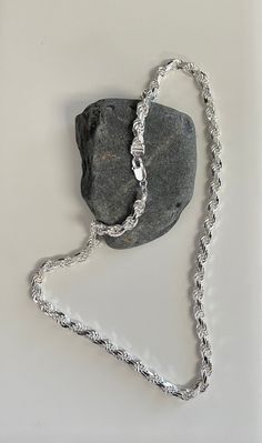 Imported from Italy and .925 Sterling Silver our 1.5 mm Diamond-cut Rope chain looks great on its own or with your favorite pendant. Your choice of length and width for a unisex look Secure lobster claw clasp Solid sterling silver makes this classic design a great investment piece Style # SC176, SC177, SC180, SC181, SC182 SC6365 Elegant Rope Chain Link Jewelry, Luxury Jewelry With Rope Chain Link, Luxury Rope Chain Link Jewelry, White Gold Round Rope Chain Necklace, Rope Chain Jewelry With Oval Links As A Gift, Sterling Silver Link Necklace With Rope Chain, Silver Chain Link Jewelry With Rope Chain, Silver Rope Chain Link Jewelry, Silver Rope Chain Jewelry