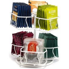 three tiered rack holding tea bags and coffee packets on white background with clippings