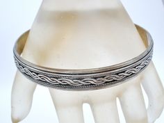 Vintage Fine Jewellery - This is a round sterling silver bangle bracelet with a braided design. It is hallmarked 925, weighs 24.5 grams, .38" wide, very well made. Silver Braided Bangle Bracelets, Traditional Silver Braided Bangle Bracelet, Silver Engraved Braided Bangle Bracelets, Engraved Silver Braided Bangle Bracelets, Silver Bangle Bracelet, Vintage Fine Jewelry, Sterling Silver Bangle Bracelets, Sterling Silver Bangle, Silver Bangle Bracelets