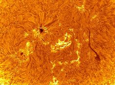 the sun's surface is shown in this image from nasa, which shows bright orange and