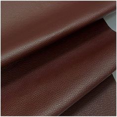 brown leather with white stripeing on the bottom and side, in two different colors