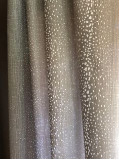 a curtain with white dots on it