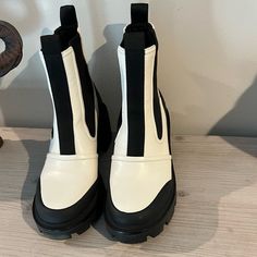 Euc Tory Burch Chelsea Boots Size 10.5 Ivory And Black. No Box White Closed Toe Boots Medium Width, White Medium Width Closed Toe Boots, Chic Cream Boots With Lug Sole, Elegant White Round Toe Boots, White Boots With Contrast Sole And Round Toe, White Flat Heel Boots With Medium Width, White Boots With Flat Heel And Medium Width, White Flat Heel Boots Of Medium Width, White Flat Heel Boots Medium Width