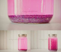 a jar filled with pink liquid sitting on top of a table