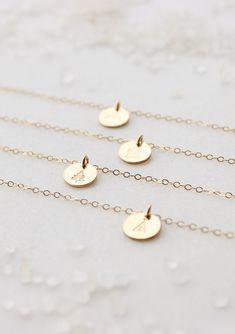 Our sweet, tiny dot stamped with one of our little symbol stamps. A solid 9mm disc is hand-stamped and attached to a delicate 18” chain. Different chain length can be requested using 'Notes' at checkout. Available in Sterling Silver and 14kt Gold Fill. Handmade in Eau Claire, WI. All of our jewelry is handmade to order just for you so each piece will be unique and may vary slightly from what is pictured. Due to its handmade nature, please allow 3-5 business days for orders to ship. Layered Chains, 14kt Gold, Cable Chain, Chain Lengths, Chain Length, Hand Stamped, Handmade Natural, Gold Filled, Pearl Necklace