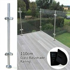 the glass balustrade railing is installed on top of a deck with an image of a garden behind it