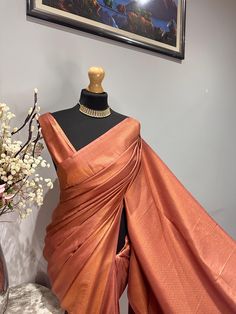 Elevate your wardrobe with this exquisite saree, perfect for parties and traditional events! Its luxurious sheen and elegant border make it a standout choice for any occasion. Perfect for any occasion(wedding or parties). An apt pick for wedding or any kind of occasion. Dry clean only. Full Finishing: This saree comes with full finishing, falls and pico done. Blouse Details: Unstitched blouse included, crafted from the same high-quality fabric and colour as the saree for a seamless finish. * Ple Formal Katan Silk Pre-draped Saree, Formal Art Silk Pre-draped Saree With Self Design, Elegant Party Katan Silk Traditional Wear, Formal Festive Dola Silk Saree, Festive Formal Art Silk Pre-draped Saree, Formal Unstitched Dola Silk Saree, Elegant Banarasi Silk Traditional Wear For Party, Formal Art Silk Pre-draped Saree For Diwali, Elegant Orange Lehenga With Traditional Drape