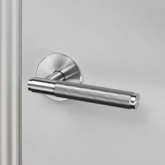 an open door with a metal handle on the front and side panel, in stainless steel