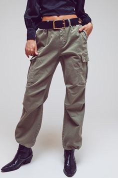 Upgrade your casual wardrobe with our Cargo Pants with Tassel Ends in Military Green. These full-length pants feature a cargo style, adding a touch of utility and functionality to your outfit. Crafted from stretch denim, these pants offer flexibility and ease of movement. The straight leg silhouette provides a classic and versatile look, perfect for casual occasions. Designed with belt loops and functional pockets, including side pockets, these cargo pants combine style and practicality. The tie Military Green Pants, Statement Scarf, Baggy Cargo Pants, Stretch Denim Fabric, Green Cargo Pants, Casual Belt, Cargo Style, Perfect Wardrobe, Military Green