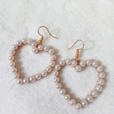 White Heart Pearl Gold Tone Earrings Heart-shaped Pearl Earrings For Valentine's Day, White Pearl Earrings For Valentine's Day Party, White Earrings For Valentine's Day Party, White Heart Beads Drop Earrings, White Drop Earrings With Heart Beads, White Heart Beads Jewelry For Party, White Heart-shaped Pearl Earrings For Party, White Dangle Heart Bead Earrings, White Heart Bead Dangle Earrings