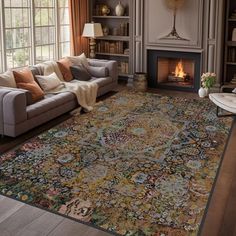 a living room filled with furniture and a large rug on the floor in front of a fire place