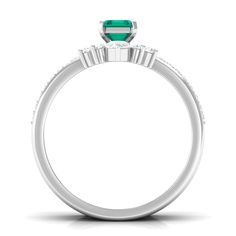 Product Details Bring an elegant touch to her overall look on a special day by presenting our Engagement Ring Set. Embellished with Octagon shape Emerald secured by Prong Setting while dainty Round Diamond studded on enhancer ring. The stunning Emerald Ring Set makes an excellent type of ring that will elevate any outfit with ease. Make her feel out of this world with this Trio Ring Set. Product Information SKU SHP-RINGS032219007 Weight 4.00 gm (Approximate) EMERALD INFORMATION No.of Stones 1 Pieces Total Weight 0.66 Carat (Approximate) Dimension(approx) Emerald Cut-4X6 mm-1 Pcs Color Green Cut Brilliant Shape Emerald Cut Setting Type Prong-Setting Quality Grade AAA DIAMOND INFORMATION No.of Stones 28 Pieces Total Weight 0.68 Carat (Approximate) Dimension(approx) Round-1.20X1.20 mm-23 PcsR Elegant Emerald Ring With Halo Design For Formal Occasions, Elegant Emerald Ring With Halo Design For Formal Events, Elegant Formal Emerald Ring With Halo Design, Princess Cut Diamond Ring For May Birthstone, White Gold Emerald Princess Cut Wedding Ring, Elegant Emerald Ring With Halo Design For Wedding, Elegant Emerald-cut Wedding Birthstone Ring, Formal May Birthstone Diamond Ring With Halo Design, Wedding Diamond Ring With Side Stones In Emerald Cut