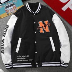 Never Worn! Trendy Black Varsity Jacket With Pockets, Black College Style Varsity Jacket With Pockets, Black Casual Varsity Jacket With Pockets, Black Outerwear With Pockets For College, College Style Black Outerwear With Pockets, White Varsity Jacket With Contrast Color For Fall, White Oversized Long Sleeve Varsity Jacket, Black Varsity Jacket For College In Spring, Black Oversized Outerwear For College