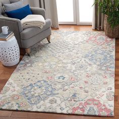 a living room area with a chair and rug