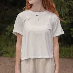 Meet the Darling Tee — It features a relaxed boxy silhouette that hits the waist perfectly, it offers gently distressed details and a 90's fade for true vintage lovers. Crafted from locally sourced cotton, this tee combines a light, airy feel with a structured yet soft touch, making it comparable to a loved vintage tee. Used with the softest local 100% cotton* low gauge knit. Garment washed and dyed each tee for a beautiful natural worn-in look. Made in Los Angeles, USA Content: 100% Cotton Plea Relaxed Fit Cropped T-shirt For Everyday, Organic Cotton Crew Neck Cropped T-shirt For Summer, Summer Effortless Soft-washed T-shirt, Summer Boxy Fit Washed Tops, Soft-washed Boxy Tops For Everyday, Soft-washed Boxy Top For Everyday Wear, Boxy Soft-washed Tops For Everyday, Everyday Spring Cropped Soft-washed T-shirt, Organic Cotton Short Sleeve Cropped T-shirt For Summer