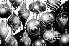 black and white christmas ornament background with silver baubles hanging from chains