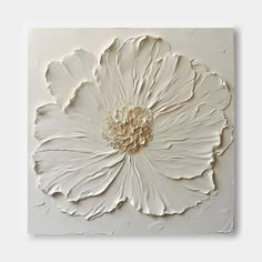 a large white flower is mounted on the wall in an art work style with acrylic paint