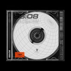 the cd cover is black and white with an orange sticker on it's side