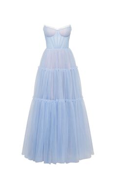 Dreamy tulle dress in light blue color with a light ruffled tulle maxi skirt. This dress has a heart-shaped boned semi-transparent bodice with built-in cups and a corset back, which makes the silhouette fitted and elegant. The A-line maxi skirt is made from multiple layers of delicate tulle that emphasize the hourglass silhouette. The waistline is adorned with a silver belt with Milla’s signature. Details: Material: Tulle Fabric composition: 100% Polyester, 100% Nylon Sleeve style: Sleeveless Si Blue Tulle Dress With Lined Bodice, Voluminous Tulle Floor-length Dress, Floor-length Voluminous Tulle Dress, Voluminous Floor-length Tulle Dress, Sheer Tulle Maxi Evening Dress, Sheer Tulle Maxi Dress For Evening, Blue Tulle Dress With Boned Bodice, Sheer Bodice Organza Maxi Dress, Maxi Length Organza Gown With Tulle Skirt