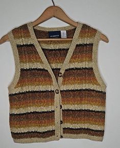 Vintage Liz Claiborne Wool & Silk Blend Sweater Vest - Size Petite - Excellent Condition This stunning vintage sweater vest from Liz Claiborne is a perfect blend of wool and silk, offering both warmth and a luxurious feel. The intricate cable knit design, combined with earthy tones, adds timeless charm to any outfit. Size: Petite Fabric: Wool & Silk Blend Style: Button-up with a flattering V-neck Details: Classic vintage vibes with beautiful cable knit patterns Condition: Excellent vintage condi Vintage Sweater Vest, Cable Knit Vest, Vintage Liz Claiborne, Vintage Pullover, Vintage Mode, Vest Outfits, Vintage Vibe, Knit Vest, Mode Vintage