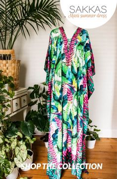 This caftan dress cover-up is made of lightweight material with no structure so that it drapes effortlessly and elegantly. It is very forgiving and loose-fitting for maximum comfort and best wear. Vibrant Print V-neck Kaftan For Beachwear, Flowy V-neck Beach Dress With Tropical Print, Bohemian Flowy V-neck Swimwear, Long Beachwear Kaftan For Resort, Resort Beachwear Long Kaftan, Resort Beach Cover-up Kaftan In Maxi Length, Resort Beach Cover-up Kaftan Maxi Length, Resort Beach Cover-up Maxi Length Kaftan, Resort Beach Cover-up Maxi Kaftan