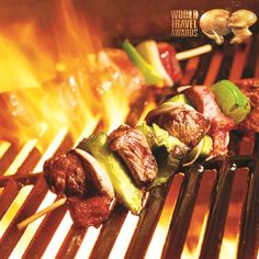 an advertisement for the magic puzzles featuring meat and vegetables on skewers with flames in the background