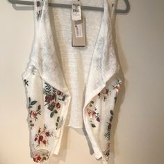 Embroidered White Vest, Draped Open Front, Sleeveless, Draped Over Lay With Floral Embroidery. Made In Italy. Sold Out At Nordstrom’s. Nwt With Small Stain Than Will Wash Out - See Photo. Pit To Pit: 24” Length: 27” Condition: Excellent White Embroidered Summer Vest, White Embroidered Spring Vest, Spring Embroidered White Vest, Sleeveless Embroidered Top For Spring With Intricate Embroidery, Sleeveless Embroidered Top For Spring, White Embroidered Vest For Spring, Casual Fitted Vest With Floral Embroidery, Sleeveless Spring Embroidered Top With Floral Embroidery, Sleeveless Embroidered Spring Vest