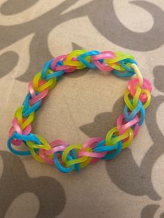 a multicolored bracelet sitting on top of a table