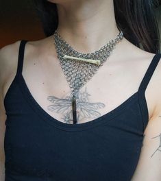 A bandana like  handweaved chainmaille necklace using 4 in 1 European style weave and a half half weave for the chain. The bone is from a rat that's been drilled and attached with jump rings. Smokey quartz crystal dangling from the bottom. Ethically sourced bones, stainless steel hardware. Safe for sensitive skin. Tarnish resistant. Gothic Metal Chainmail Choker, Bohemian Chainmail Metal Jewelry, Chainmaille Necklace, Streetwear Jewelry, Energy Protection, Real Bones, A Rat, Milwaukee Wi, The Bone