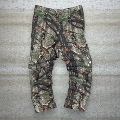 "Vintage Hunting Camo Tactical Pants Baggy Fit Cargos Crazy Woodland Pattern 90s Skate / Streetwear Great Condition: 9/10 Men's Size:  Waist: 34\" Length (inseam): 32\" Leg Opening: 8.5\" Thigh Opening: 12\" Front Rise: 13\"" Combat Style Cargo Pants For Hunting, Tactical Camouflage Bottoms With Pockets, Camouflage Techwear Bottoms For Outdoor Activities, Techwear Camouflage Bottoms For Outdoor Activities, Camouflage Bottoms With Multiple Pockets For Outdoor, Baggy Camouflage Parachute Pants For Outdoor, Camouflage Outdoor Bottoms With Multiple Pockets, Outdoor Camouflage Bottoms With Multiple Pockets, Military Style Hunting Bottoms With Pockets