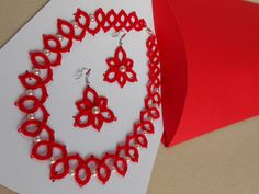 Necklace, earrings Tatted lace jewelry set red READY TO SHIP Gift wrapped New Particular, special, handmade jewelry for festive occasions Delicate lace made of pure cotton thread. Unique handmade tatted jewelry set , necklace with earrings made out of  red cotton thread with added  white beads. Many hours of handwork are woven into this beautiful jewelty My handcrafted made with a lot of love and skill acquired over the years.   Jewelry set made of thread using the frivolite technique. Circles and arches are formed with the help of a needle or a chunk for frivolites, and different shapes can be obtained by combining these elements. This technique is used to make smaller laces, collars, jewelry ...  Jewelry set made out of  red cotton string with added white  beads.  The length of the neckl Handmade Festive Jewelry For Valentine's Day, Handmade Jewelry For Valentine's Day Party, Handmade Jewelry For Party Gifts, Handmade Jewelry For Parties And Gifts, Handmade Jewelry For Party And Gift-giving Occasions, Handmade Red Jewelry For Celebration, Red Necklaces For Mother's Day Party, Red Necklace For Mother's Day Party, Red Festive Jewelry For Gifts