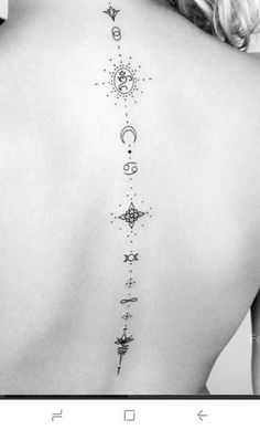 the back of a woman's neck with stars and moon tattoos on her left side