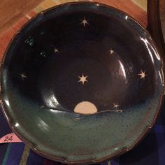 a bowl with stars on it sitting on a table