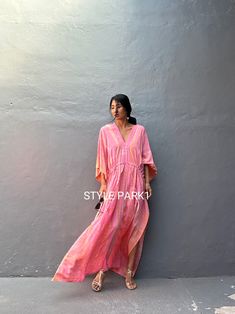 "\"Sanur\" Kaftan  Rayon Fabric. Perfect for Elegant Day and Nightwear or worn as a cover-up for that beach or poolside statement of glamour. And for Muslim women Bali Hand  Tie-dyed Pink   &  Orange  multi motif Measurements in CM and Inches.  American measurement  Medium to Large.  It fits all the body sizes between M to2X Size - One size fits all American size From M to 2XL Total wide /220cm/86inch(round) Chest & him /180cm/70inch(round) The length /140cm/55inch Please see the professional mo Pink V-neck Boho Dress For Beach Cover-up, Flowy Pink Boho Dress For Beach Cover-up, Pink Bohemian Dress For Beach Cover-up, Pink Boho Tunic Dress, Pink V-neck Tunic For Beach Cover-up, Pink Tunic Maxi Dress For Summer, Pink Summer Tunic Maxi Dress, Pink Maxi-length Cover-up For Vacation, Pink Maxi Length Cover-up For Vacation