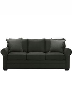 a black couch with two pillows on it's back and one arm facing the camera