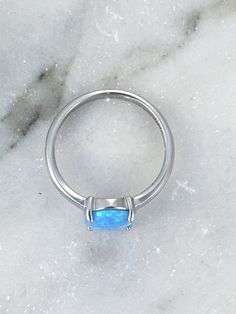 Opal Ring / Opal Ring Silver / Opal Oval Ring / Gifts for Women /Women's Opal Ring/ Sterling Silver Opal Ring Blue, oval shaped, opal set in Sterling Silver. The colors are very pretty with flashes of blue, aqua and green. Simple and dainty. Perfect for everyday wear. 8mm Lab created opal, 2mm sterling silver band. Thanks so much for stopping by. Feel free to contact me with any questions. More jewelry from Penelope's Porch: https://www.etsy.com/PenelopesPorch Oval Metal Ring For Promise, Adjustable Opal Crystal Ring, Oval Shape, Adjustable Opal Oval Crystal Ring, Adjustable Oval Opal Crystal Ring, Nickel-free Opal Promise Ring, Minimalist Nickel-free Oval Rings, Nickel Free Oval Crystal Promise Ring, Nickel Free Oval Crystal Ring, Nickel-free Oval Crystal Promise Ring