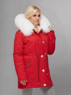 Elevate your winter wardrobe with the Women's Red Parka with White Fur, a stylish and cozy outerwear essential that combines fashion and function seamlessly. Crafted with attention to detail, this parka features a vibrant red hue that adds a pop of color to any cold-weather ensemble. The bold shade is perfect for making a statement while staying warm and comfortable during chilly days. The parka is adorned with luxurious white fur trim along the hood, adding a touch of elegance and sophistication. Not only does the fur trim provide a chic aesthetic, but it also offers extra warmth and insulation, making it ideal for braving the cold in style. Designed with practicality in mind, this parka boasts a classic silhouette with a mid-length hemline, providing ample coverage and protection against Red Winter Outerwear With Detachable Hood, Red Winter Parka With Pockets, Red Fur Coat With Faux Fur Trim For Winter, Red Winter Fur Coat With Faux Fur Trim, Winter Red Fur Coat With Faux Fur Trim, Red Outerwear With Faux Fur Trim For Cold Weather, Red Hooded Winter Parka, Red Long Sleeve Fur Coat For Winter, Red Winter Parka With Double-lined Hood