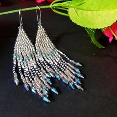 Wedding Long Fringe Earrings.Silvery And White Color. Silver blue Crystals Earrings. Sparkling, Gentle Seed Beads, Indian Jewelry. Beautiful Gift For Women. Gradient long fringe bead tassel earrings . Gradient bead Waterfall earrings.Boho style Seed Beads earrings.Long dangle earrings. Beautiful, Elegant Earrings .A beautiful Christmas gift for women and girlfriend. These are long but not heavy earrings. Length of earrings 12cm (4 inches). Width of earrings 0.78 inches. To create these earrings Blue Dangling Beads Earrings For Celebration, Party Beaded Earrings With Silver Round Beads, Blue Beaded Earrings For Celebration, Handmade Silver Long Drop Beaded Earrings, Silver Beaded Chandelier Earrings In Sterling Silver, Silver Beaded Sterling Silver Chandelier Earrings, Silver Beaded Earrings With Dangling Beads For Party, Silver Beaded Dangling Earrings For Party, Silver Beaded Drop Chandelier Earrings Gift