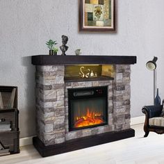 a living room with a fire place in the center and a chair next to it