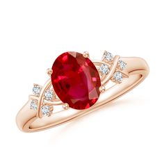 a ring with a large red stone and two white diamonds on the band, set in 18k rose gold