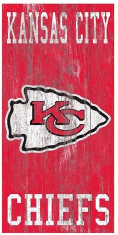 the kansas city chiefs logo on a wooden sign