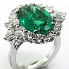 This Dazzling and Substantial Emerald Ring Features a Extra Extra Fine Emerald Center Stone with 3.06ct Diamond Side Stones. An Excellent Choice for any Occasion!!! All of the Stones are Beautifully White and Display Absolutely Phenomenal Sparkle! The Sizable Oval Cut Emerald is Certified by GIA!!! The World's Premier Gemological Authority!!! See the pictures for the exact GIA Certificate that goes with the ring. The Ring is being sold from Da Vinci Fine Jewelry, Inc., with a Gift Box, GIA Certi Exquisite Oval Brilliant Cut Gemstones, Exquisite Oval Brilliant-cut Gemstones, Oval Brilliant Cut Dazzling Gemstones, Dazzling Oval Brilliant Cut Gemstones, Dazzling Oval Gemstones With Brilliant Cut, Dazzling Oval Emerald Ring In Platinum, Luxury Oval Emerald Ring With Diamond Cut, Dazzling Oval Emerald Ring With Brilliant Cut, Oval Emerald Ring With Diamond Cut In Platinum